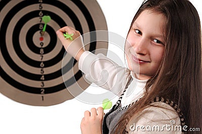 Success. Girl hitting the darts target Stock Photo