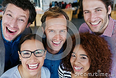 Success is a great feeling. Closeup portrait of a group of estatic coworkers standing in an office. Stock Photo