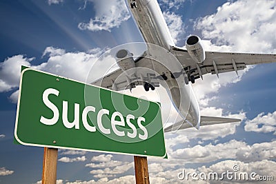 Success Green Road Sign and Airplane Above Stock Photo