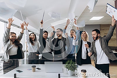 Success and winning concept - happy business team celebrating victory in office Stock Photo