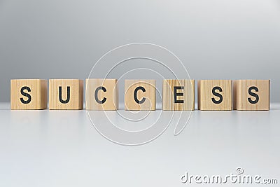 Success word from wooden blocks on desk. Business success Stock Photo