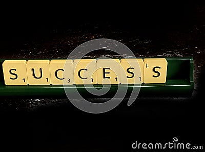 Success word written on scrabble blocks for content creation Editorial Stock Photo