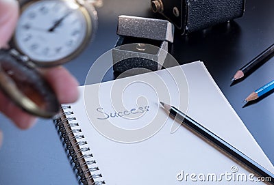 Success is written on small notepad Stock Photo