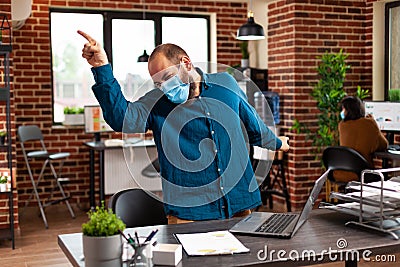 Successful ambitious businessman making satisfaction dance moves after winning business partnership Stock Photo