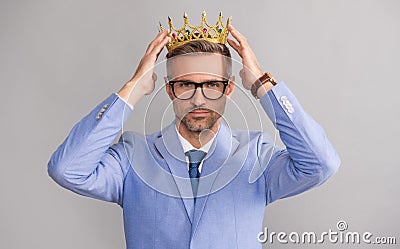 successful arrogant man wear king crown. business success and reward. Stock Photo