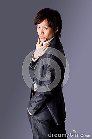 Successful Asian business man thinking Stock Photo