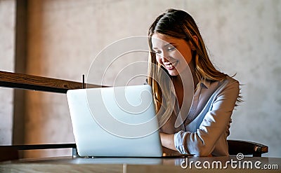 Successful business female grapic designer using laptop computer during working process in office Stock Photo