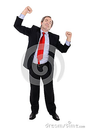 Successful business man cheering Stock Photo