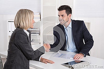 Successful business meeting with handshake: customer and client. Stock Photo