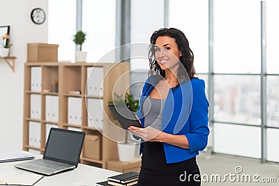 Successful business woman looking confident and smiling. Stock Photo