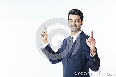 Successful businessman in black suit and tie pointing up with both hands Stock Photo