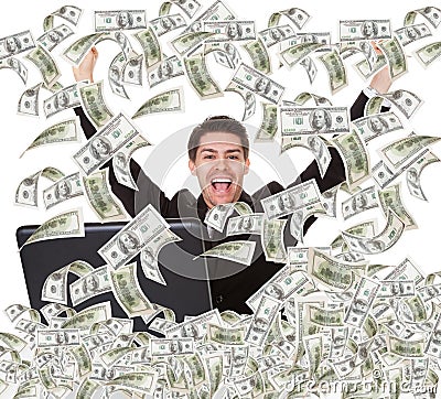 Successful businessman with money rain Stock Photo