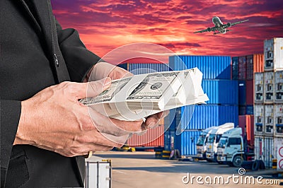 Successful businessmen hold a lot of money on containers box wi Stock Photo