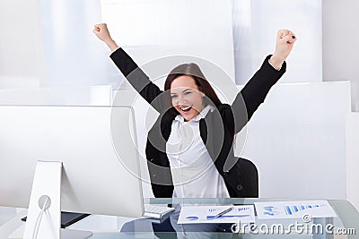 Successful businesswoman in office Stock Photo