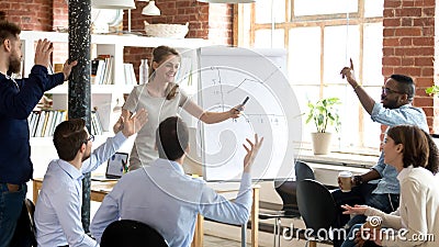 Diverse people voting raising hands during seminar Stock Photo