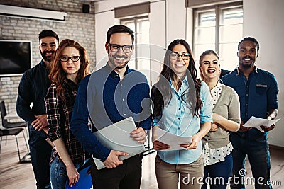 Successful company with happy workers Stock Photo