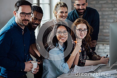 Successful company with happy workers Stock Photo