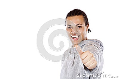 Successful dark-skinned teenager holds thumb up Stock Photo