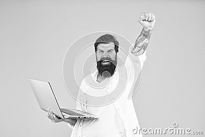 Successful developer. Bearded man with notebook. Online shopping. Programmer with laptop. Surfing internet. Online Stock Photo