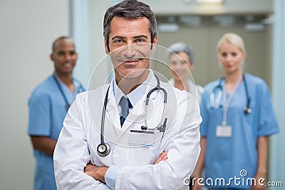 Successful doctor and his staff Stock Photo