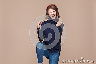 Successful expressive woman rejoicing her victory Stock Photo