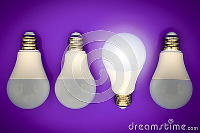 Successful idea, creativity and innovation concept. Lightbulbs upside down, one glows. Stock Photo