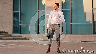 Successful lucky happy arabic indian business man boss leader candidate entrepreneur with briefcase standing outdoors Stock Photo