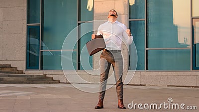 Successful lucky happy arabic spanish business man boss leader candidate entrepreneur with briefcase standing outdoors Stock Photo