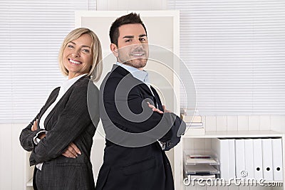 Successful male and female business team: senior and junior managing director. Stock Photo