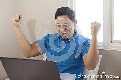 Successful Man Celebrating Victory, Entrepreneur Working Online Business From Home Stock Photo