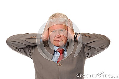 Successful mature businessman covering ears Stock Photo