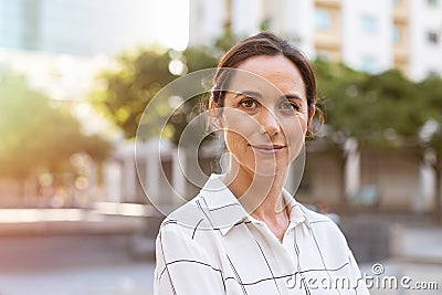 Successful mature woman looking at camera Stock Photo