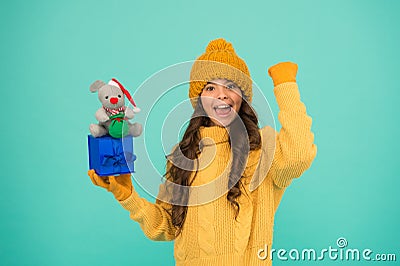 Successful rat year. Appease with gift. Shopping tips. Happy girl hold mouse toy and wrapped gift box. Kid knitted Stock Photo