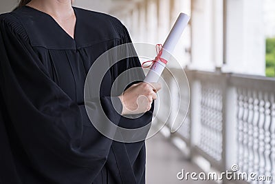 Successful student on their graduation day, graduate holding diploma, Education, Graduation and people concept Stock Photo