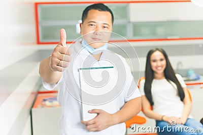 Successful visit patient to dentist doctor. Beautiful asian woman Stock Photo