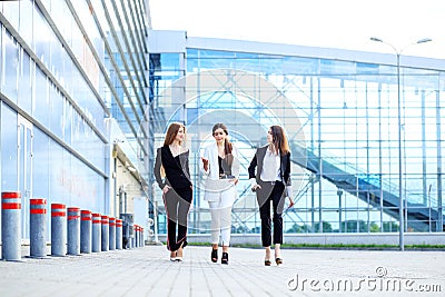Successful women go and discuss a new project. Concept for business, boss, robot, team and success Stock Photo