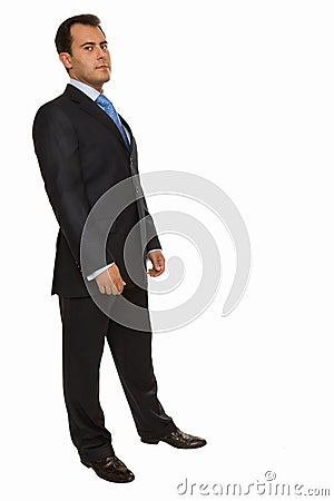 Successful young business man standing half-tuned Stock Photo