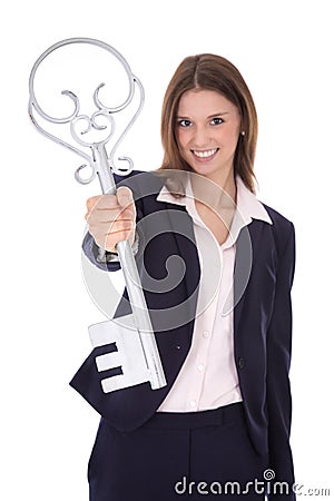 Successful young businesswoman holding a key: concept for success ar career. Stock Photo