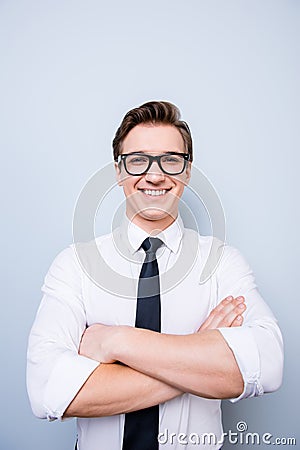 Successful young handsome geek is smiling. He is in a formal out Stock Photo