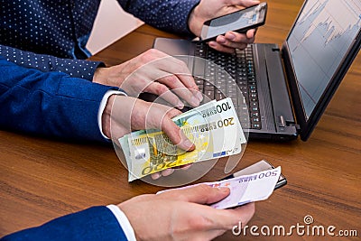 Successful young man using laptop for sale. concept making money euro Stock Photo