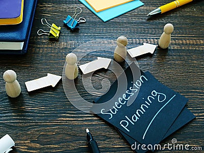 Succession planning and figurines with arrows. Stock Photo