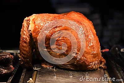 Succulent golden whole roast turkey joint of meat resting and ready to carve Stock Photo