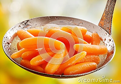 Succulent steamed whole baby carrots Stock Photo