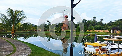 Such a beautiful windmill lake along with beautiful plants and have attractions to play Editorial Stock Photo