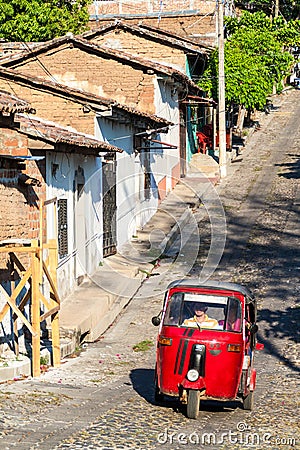 SUCHITOTO, EL SALVADOR - APRIL 9, 2016: Mototaxi on a street in Suchitoto, El Salvad Editorial Stock Photo