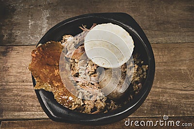 Lechona with rice, arepa and potato Stock Photo