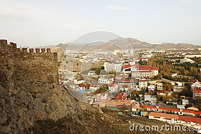 Sudak town and the part of the wall of the fortress in Crimea Stock Photo