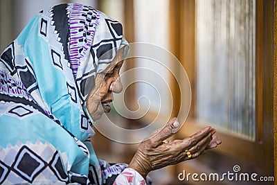 Sudanese woman praying Editorial Stock Photo