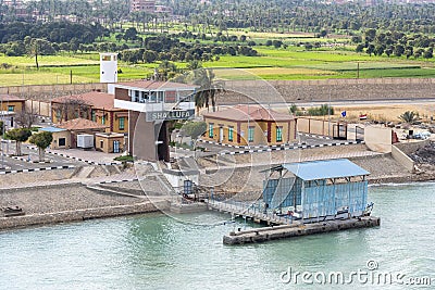 Small ferry station on the bank of the Suez Canal. Editorial Stock Photo