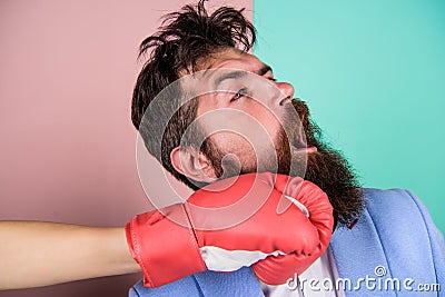 Suffering. Punch in face. Destroy beauty. Cosmetology and plastic surgery services. Strong punch. Hand in boxing glove Stock Photo